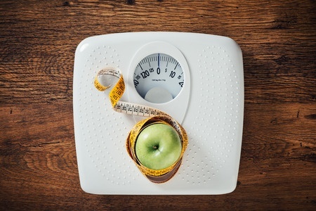 scales-with-measuring-tape-and-apple.jpg